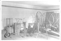 SA0662 - Photo shows wool wheels, yarn winders, and other spinning equipment., Winterthur Shaker Photograph and Post Card Collection 1851 to 1921c